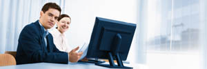 Sign up for Peter Barron Stark Companies newsletters Two employees at computer