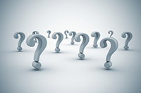 Many question marks against a gray background