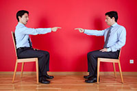 two business men pointing at each other - cross-departmental communication issues - Peter Barron Stark Companies